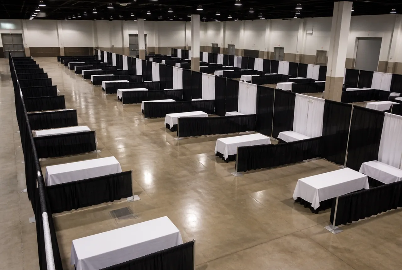Exhibition floor of booths laid out on a grid of numbered aisles running the length of the hall